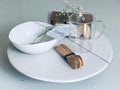 Trend{ING} Bakers Delight Baking Gift box, featuring a ceramic cake stand , glass measuring cup, wooden spoons and crunchy palmier biscuits