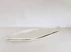 White platter on a grey background