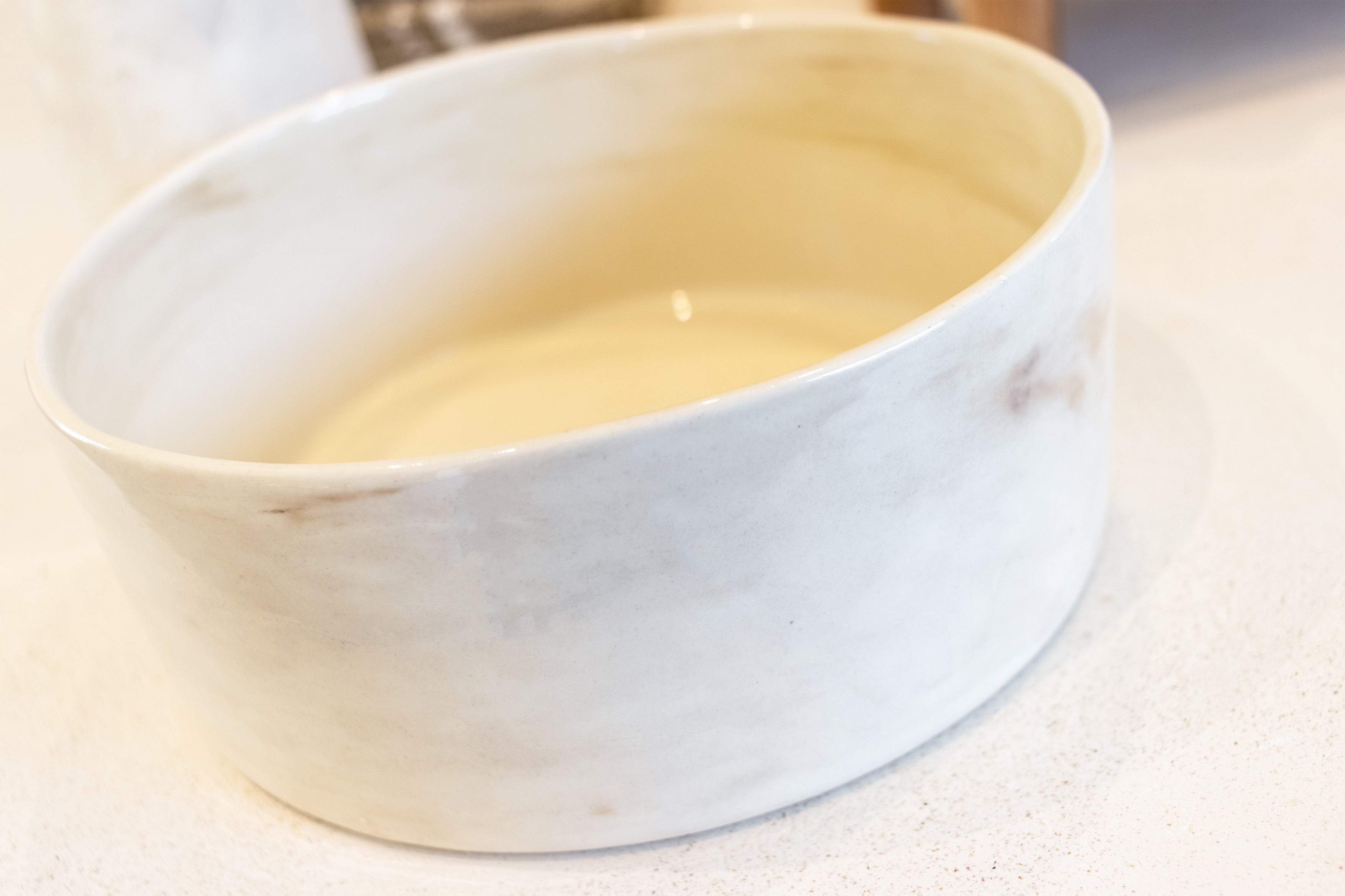 White ceramic bowl on a light surface