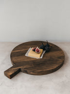 Thick round wooden serving board with handle (45cm)