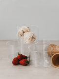 A set of 4 Glass Ice cream cups stacked, with 2 scoops of ice cream, cones and strawberries